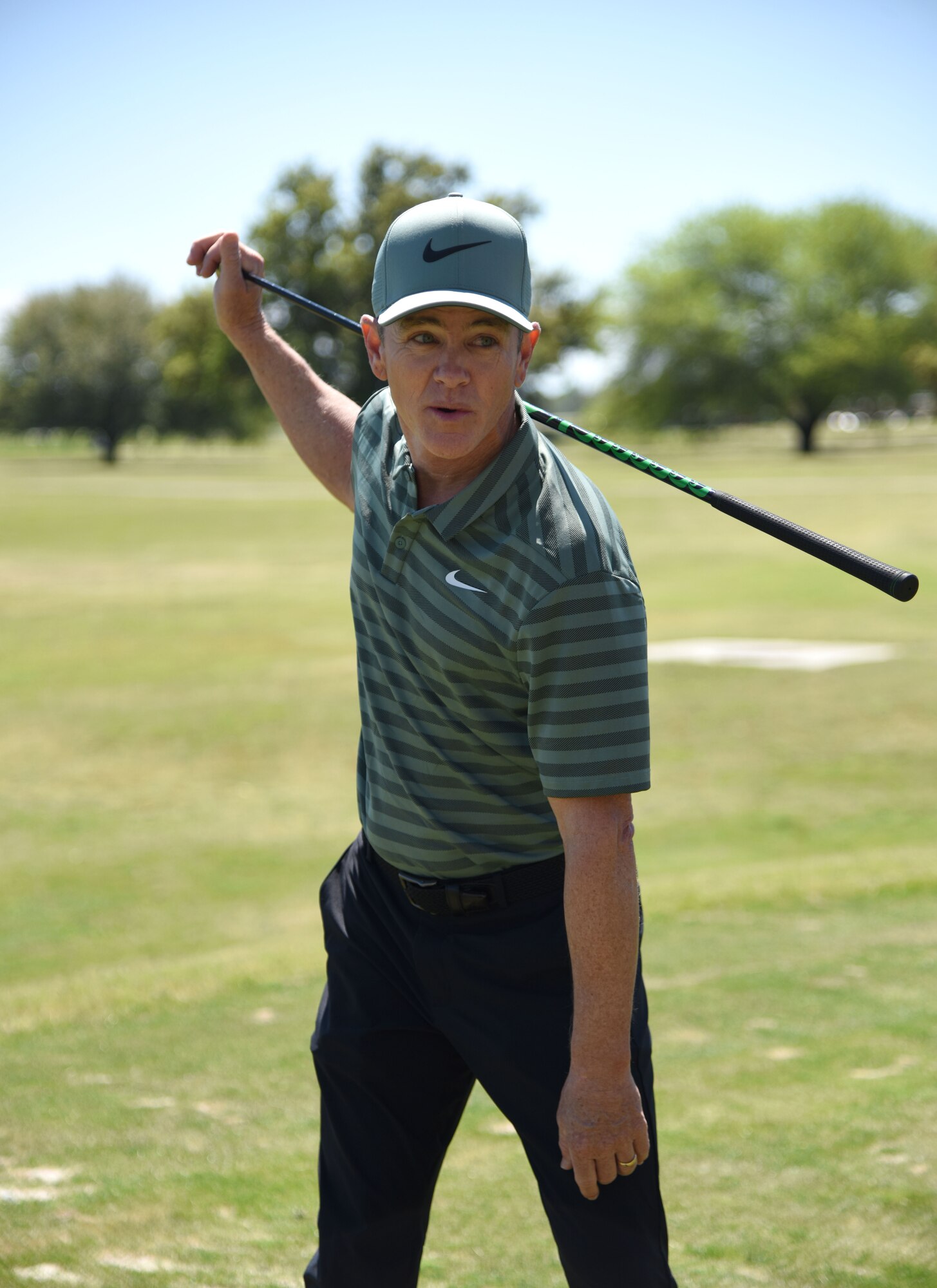 Brian Henninger, Professional Golfers’ Association champion player, provides golfing tips to Keesler personnel during a free clinic at the Bay Breeze Golf Course March 20, 2018, on Keesler Air Force Base, Mississippi. Henninger is a two-time PGA and three-time nationwide tour champion and this is the first time he has held a clinic at Keesler. (U.S. Air Force photo by Kemberly Groue)