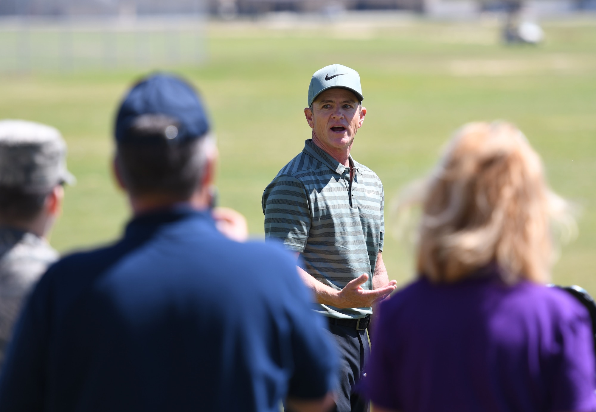 Brian Henninger, Professional Golfers’ Association champion player, provides golfing tips to Keesler personnel during a free clinic at the Bay Breeze Golf Course March 20, 2018, on Keesler Air Force Base, Mississippi. Henninger is a two-time PGA and three-time nationwide tour champion and this is the first time he has held a clinic at Keesler. (U.S. Air Force photo by Kemberly Groue)