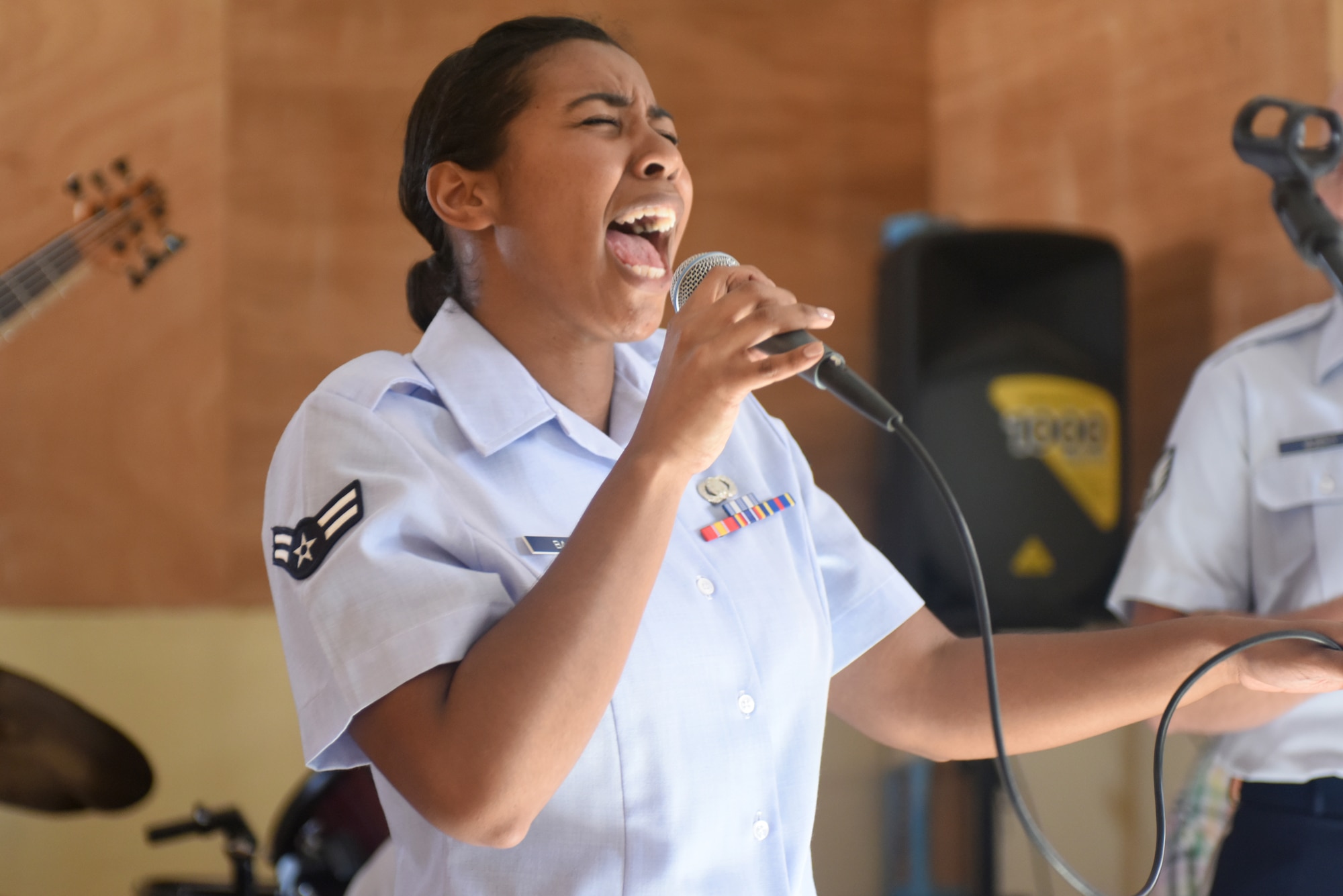 Airman 1st Class Sierra Bailey, U.S. Air Forces in Europe Band vocalist, sings for students of the National School of the Arts in Dakar, Senegal, March 21, 2018. The USAFE Band is in Dakar to support African Partnership Flight Senegal, a military-to-military event focusing on improving professional military aviation knowledge and skills. (U.S. Air Force photo by Airman 1st Class Eli Chevalier)