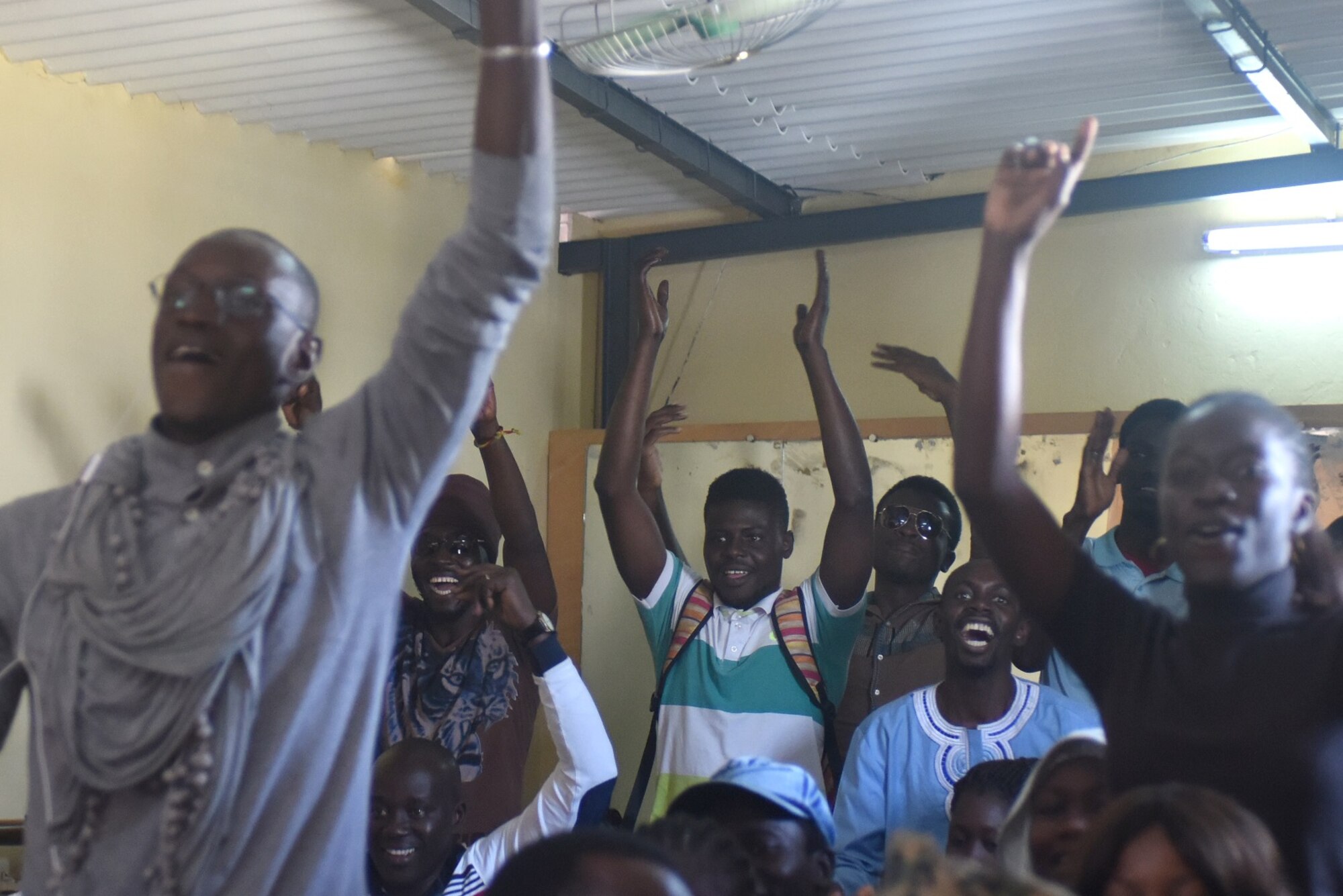 Students listen to the U.S. Air Forces in Europe Band play a popular pop song at the National School of the Arts in Dakar, Senegal, March 21, 2018.  The U.S. Air Forces in Europe Band visited the school to perform for as well as listen to the students’ music. (U.S. Air Force photo by Airman 1st Class Eli Chevalier)