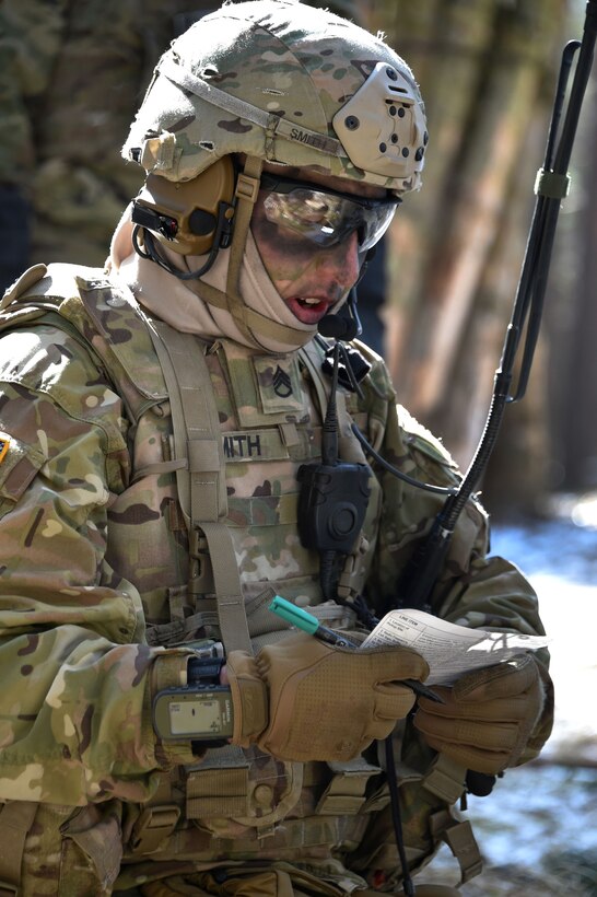 A soldier radios his headquarters leadership team.