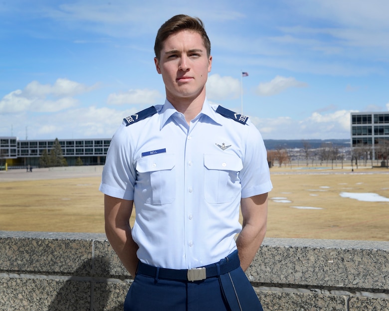 Cadet 3rd Class Jack Bell, Cadet Squadron 29, poses for a photo on the Terrazzo at the U.S. Air Force Academy, Colo., March 19, 2018. In the span of 72 hours, Bell talked a suicidal man off a Colorado Springs overpass and helped air traffic controllers in Northern California locate a downed aircraft. (U.S. Air Force photo by Staff Sgt. Charles Rivezzo)