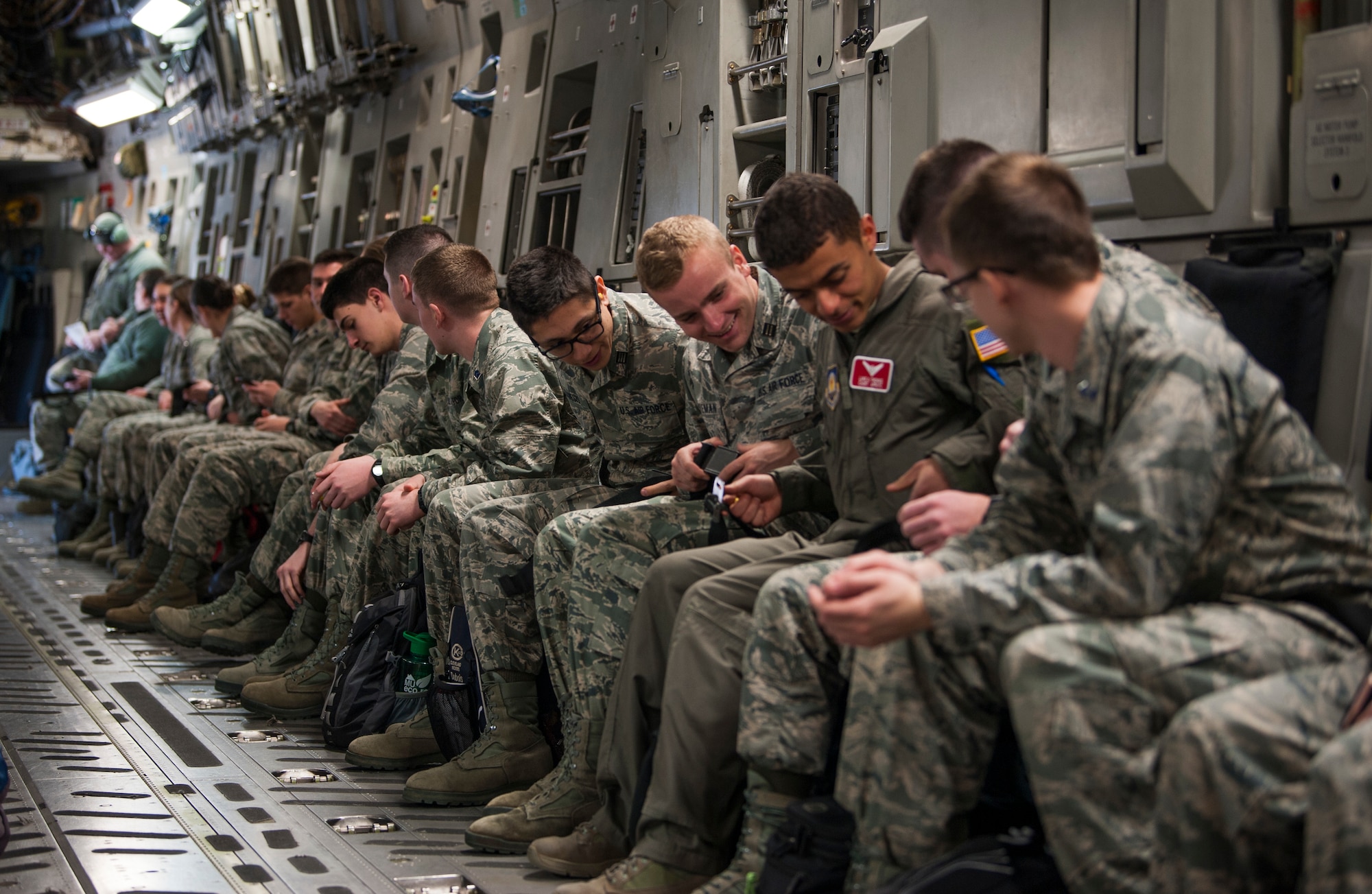 U.S. Air Force Reserve Officers Training Corps cadets assigned to Detachment 640 from Miami University, Ohio, fasten their seatbelts aboard a C-17 Globemaster III aircraft at Wright-Patterson AFB, Ohio, March 19, 2018.
