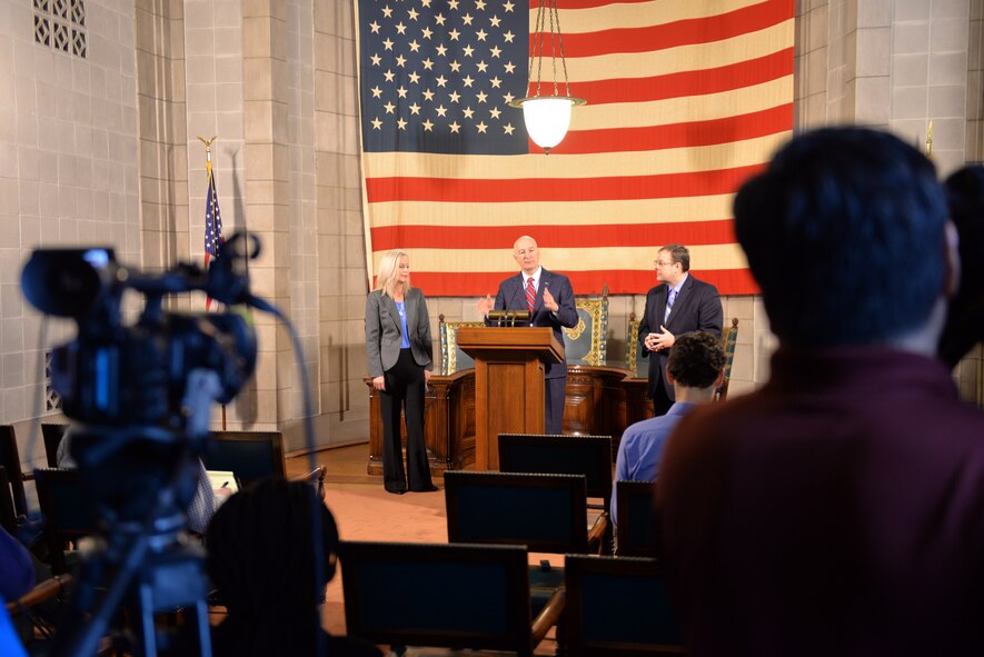 Nebraska Gov. Pete Ricketts addresses the media, March 19, 2018, at the Nebraska State Capitol in Lincoln, Nebraska after signing a change to Rule 21, which regulates state teaching licenses,which will make it easier for military spouses to teach immediately if they have recently arrived from out of state.