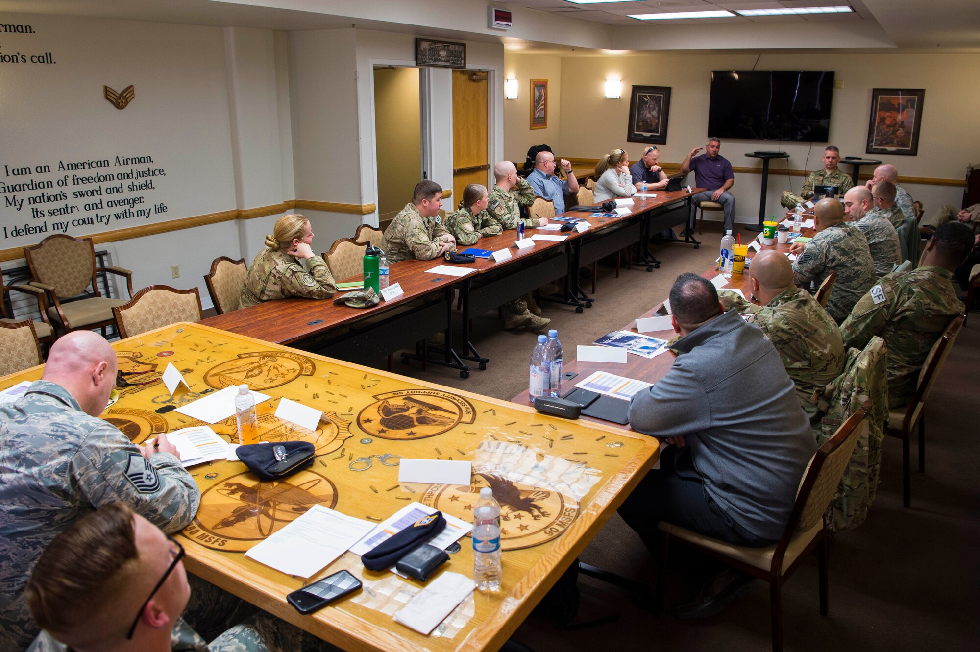 Airmen from across Air Force Global Strike command and seven federal agencies listen during a counter unmanned aerial system roundtable discussion during the CUAS Summit on F.E. Warren Air Force Base, Wyo., March 14, 2018. The event promoted cross-talk among attendees to help further develop their own CUAS programs and share best practices. (U.S. Air Force photo by Tech. Sgt. Christopher Ruano)
