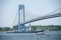 Arleigh Burke-class guided missile destroyer USS Bainbridge (DDG 96) passes under the Verrazano Bridge during a parade of ships in the New York Harbor river to mark the start of 2016 Fleet Week New York. The event Fleet Week New York, now in its 28th year, is the city's time-honored celebration of the sea services. It is an unparalleled opportunity for the citizens of New York and the surrounding tri-state area to meet Sailors, Marines and Coast Guardsmen, as well as witness firsthand the latest capabilities of today's maritime services. The weeklong celebration has been held nearly every year since 1984.