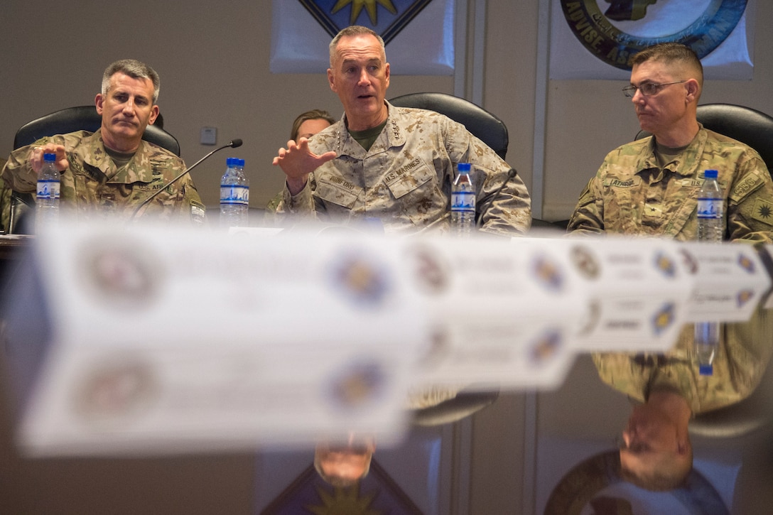 U.S. military leaders meet around a table.