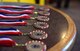 Six chief master sergeant medallions lay on a table at the Mission’s End Club at Whiteman Air Force Base, Mo., March 16, 2018.