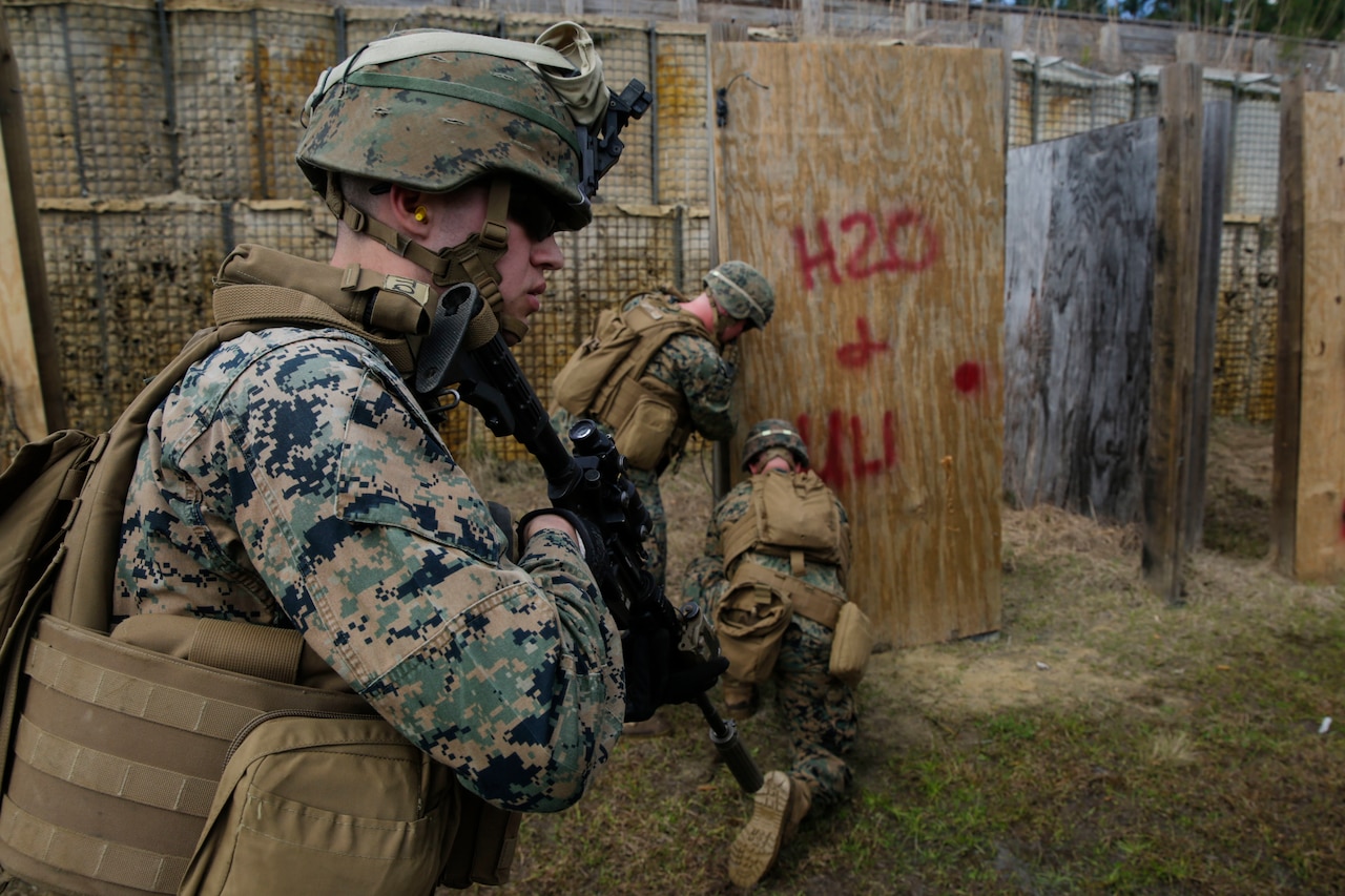 U.S. Marines from different units arm a breaching charge during an urban breaching range at Camp Lejeune, N.C., March 20, 2018. Marines from both 2nd Combat Engineer Battalion and 3rd Battalion, 6th Marine Regiment, 2nd Marine Division conducted the training together to further improve proficiency in creating and using explosive breaching charges as well as improving unit cohesion.