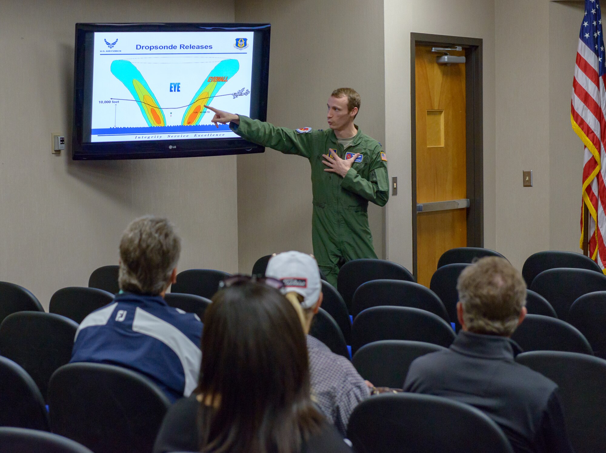 U.S. Air Force Capt. Will Simmons, 53rd Weather Reconnaissance Squadron pilot, briefs the purpose and function of the dropsonde used by hurricane hunters to the Professional Golf Association Tour attendees during the players’ tour at the 53rd WRS building March 20, 2018, on Keesler Air Force Base, Mississippi. The attending golfers who are participating in the 2018 Rapiscan System Golf Classic also toured the military working dog kennel and received a Science on a Sphere demonstration. (U.S. Air Force photo by André Askew)