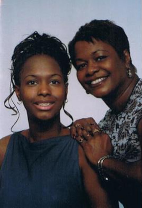 Master Sgt. Ieaka Olmstead, 22nd Operations Support Squadron host aviation resource management superintendent, and her mother pose for a photo when Olmstead was a teen.