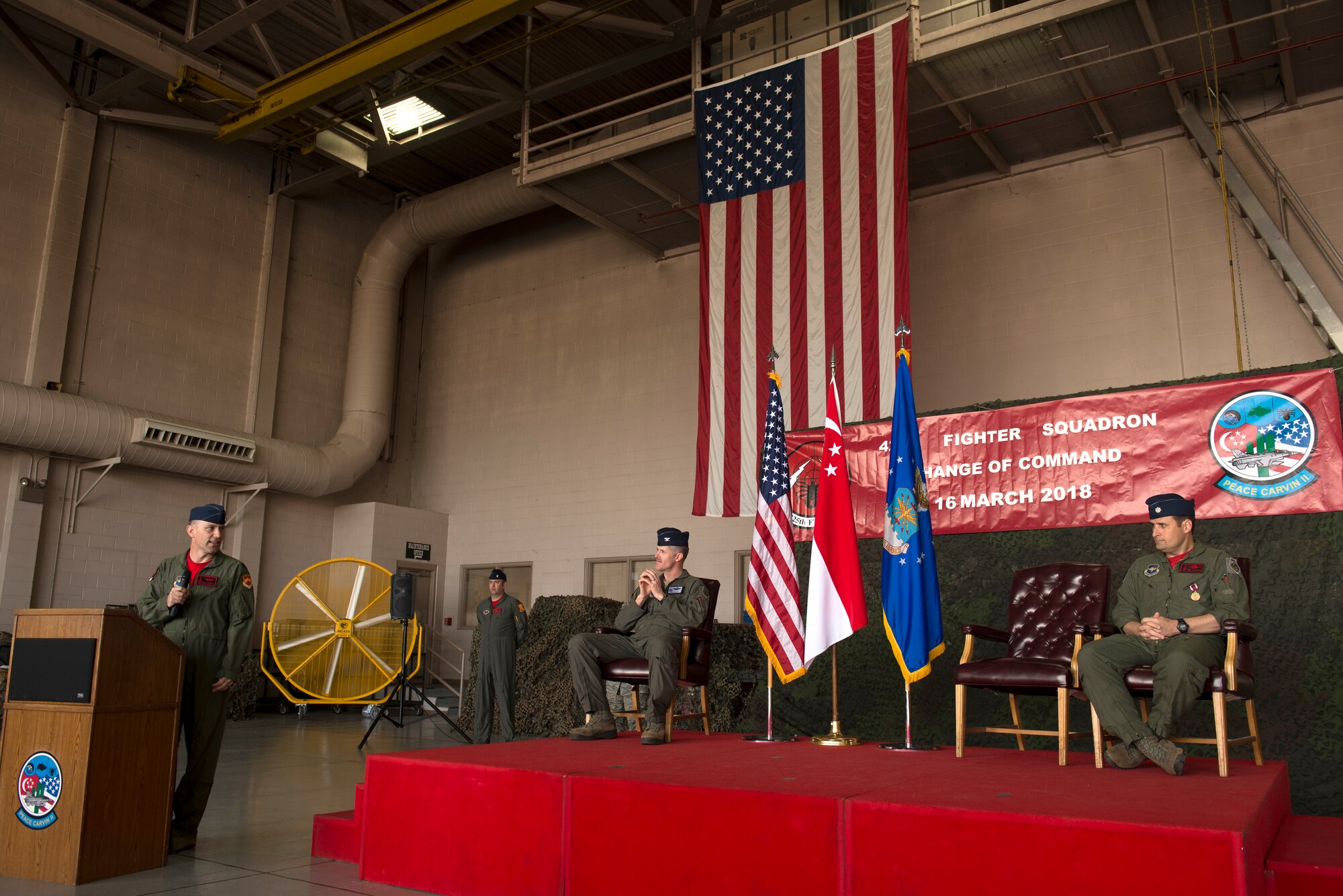 Lt. Col. Mark Whisler, 425th Fighter Squadron commander, addresses his predecessor during his acceptance speech after assuming command March 16, 2018, at Luke Air Force Base, Ariz. Whisler thanked Lt. Col. Jason Cooper for his work in leading and maintaining the squadron over the past two years. (U.S. Air Force photo/Senior Airman Ridge Shan)