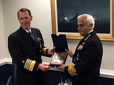 Chief of Naval Operations (CNO) Adm. John Richardson presents a plaque to Indian Navy chief Adm. Sunil Lanba at the Pentagon.  The two heads of Navy met with Secretary of the Navy Richard V. Spencer and discussed ways to integrate and improve interoperability.
