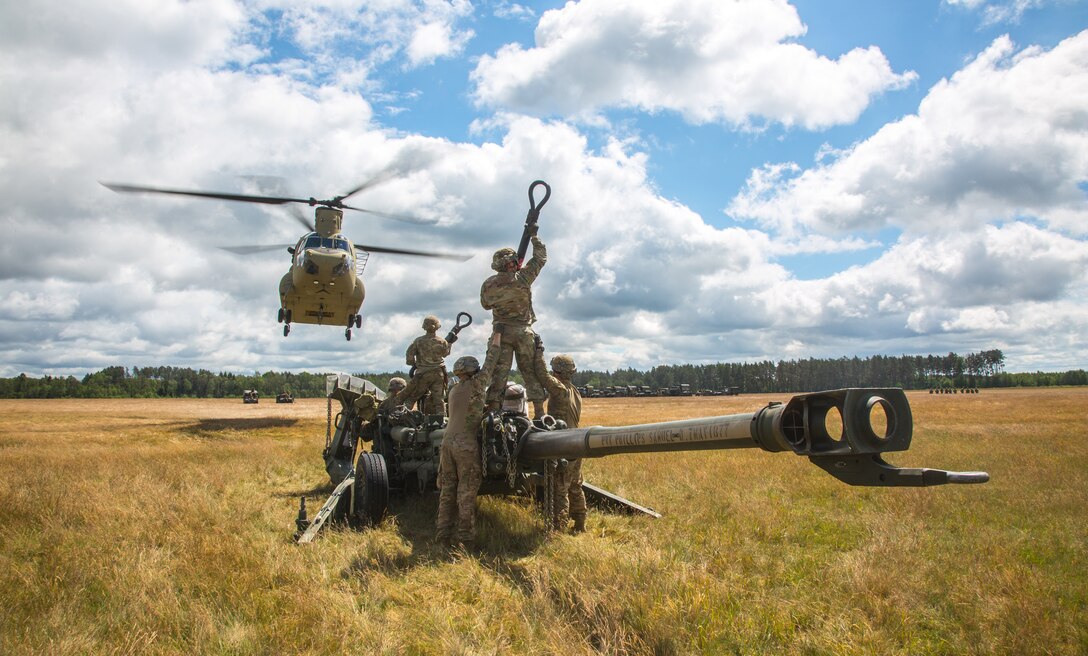 US Soldiers conduct sling load and air assault training with M777A2 Howitzers