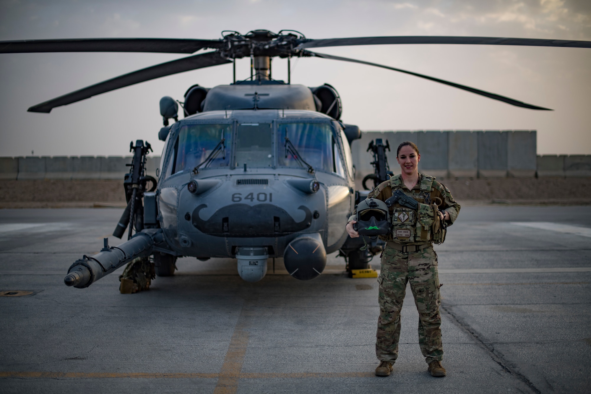 U.S. Air Force Capt. Victoria Snow, HH-60G Pave Hawk pilot, assigned to the 33rd Expeditionary Rescue Squadron, stands in front of her aircraft before a training mission with a Guardian Angel team assigned to the 308th ERQS, Kandahar Airfield, Afghanistan, in support of Operation Freedom’s Sentinel and the NATO Resolute Support mission, March 13, 2018.