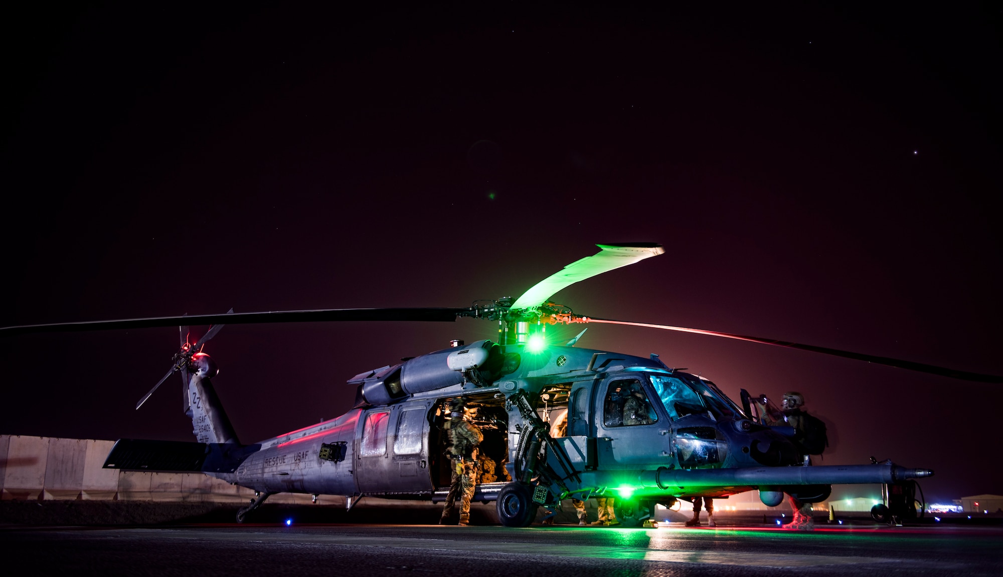 Aircrew members assigned to the 33rd and 308th Expeditionary Rescue Squadrons, prepare for a training mission with the HH-60G Pave Hawk at Kandahar Airfield, Afghanistan, in support of Operation Freedom’s Sentinel and the NATO Resolute Support mission, Mar. 13, 2018.