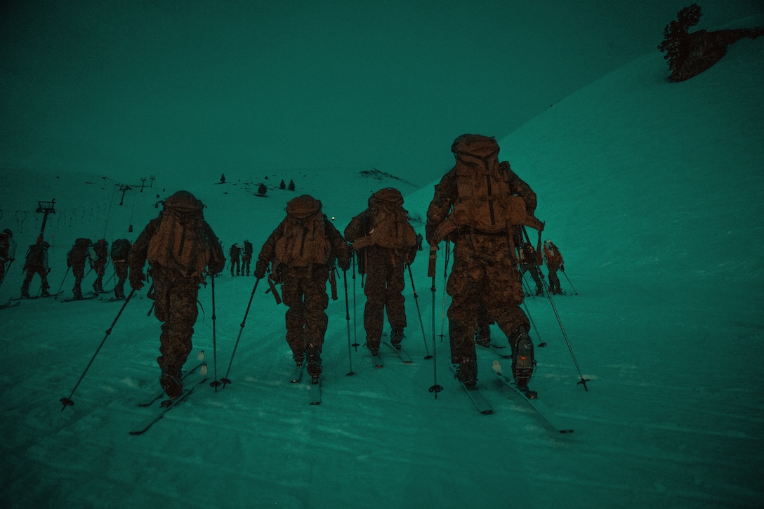 U.S. Marines from the Mountain Leaders Section, Mountain Warfare Training Center, Bridgeport, Calif., begin their ascent for the main touring event at the Mountain Troops Winter Challenge 2018, Chamrousse, France, March 14, 2018. "Team America", one of six international teams participating in the competition of mountain infantry skills and tactics. (U.S. Marine Corps photo by Lance Cpl. Preston L. Morris)