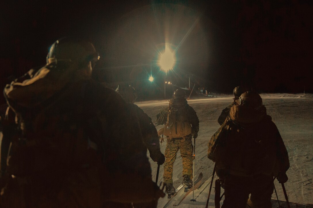 Marines from the Mountain Leaders Section, Mountain Warfare Training Center, Bridgeport, Calif., approach the summit during the touring event at the Mountain Troops Winter Challenge 2018, Chamrousse, France, March 14, 2018. "Team America" is one of six international teams participating in the competition of mountain infantry skills and tactics. (U.S. Marine Corps photo by Lance Cpl. Preston L. Morris)