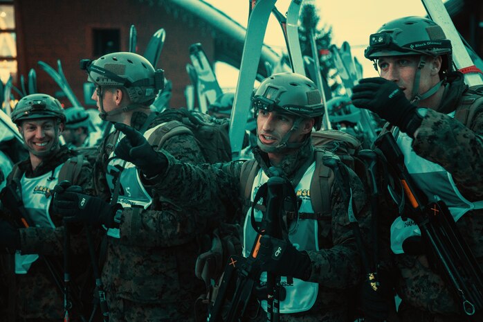 Marines from the Mountain Leaders Section, Mountain Warfare Training Center, Bridgeport, Calif., point out their course before the main touring event at the Mountain Troops Winter Challenge 2018, Chamrousse, France, March 14, 2018. "Team America" is one of six international teams participating in the competition of mountain infantry skills and tactics. (U.S. Marine Corps photo by Lance Cpl. Preston L. Morris)