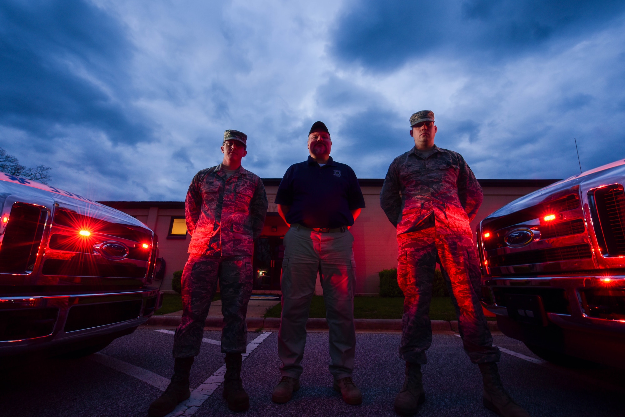 (From left,) U.S. Air Force Staff Sgt. Jerry Byrom, 20th Medical Group (MDG) emergency medical technician, Barry Reed and Airman 1st Class Brandon Starr, 20th MDG paramedics, stand outside the ambulatory service building at Shaw Air Force Base, S.C., March 21, 2018.