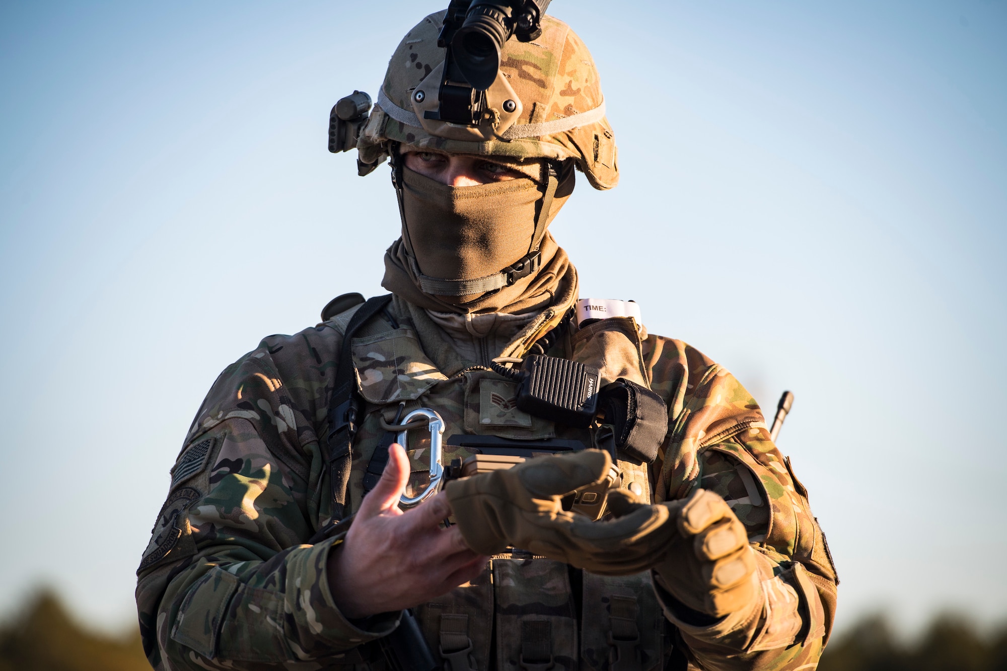 Senior Airman Bryan Bordelon, 824th Base Defense Squadron fireteam member, removes a glove during a Mission Readiness Exercise, March 13, 2018, at Joint Base McGuire-Dix Lakehurst, N.J. Evaluators tested the 824th BDS from Moody Air Force Base, Ga., and the 105th Security Forces Squadron from Stewart Air National Guard Base, N.Y., to ensure their combat readiness. (U.S. Air Force photo by Senior Airman Janiqua P. Robinson)