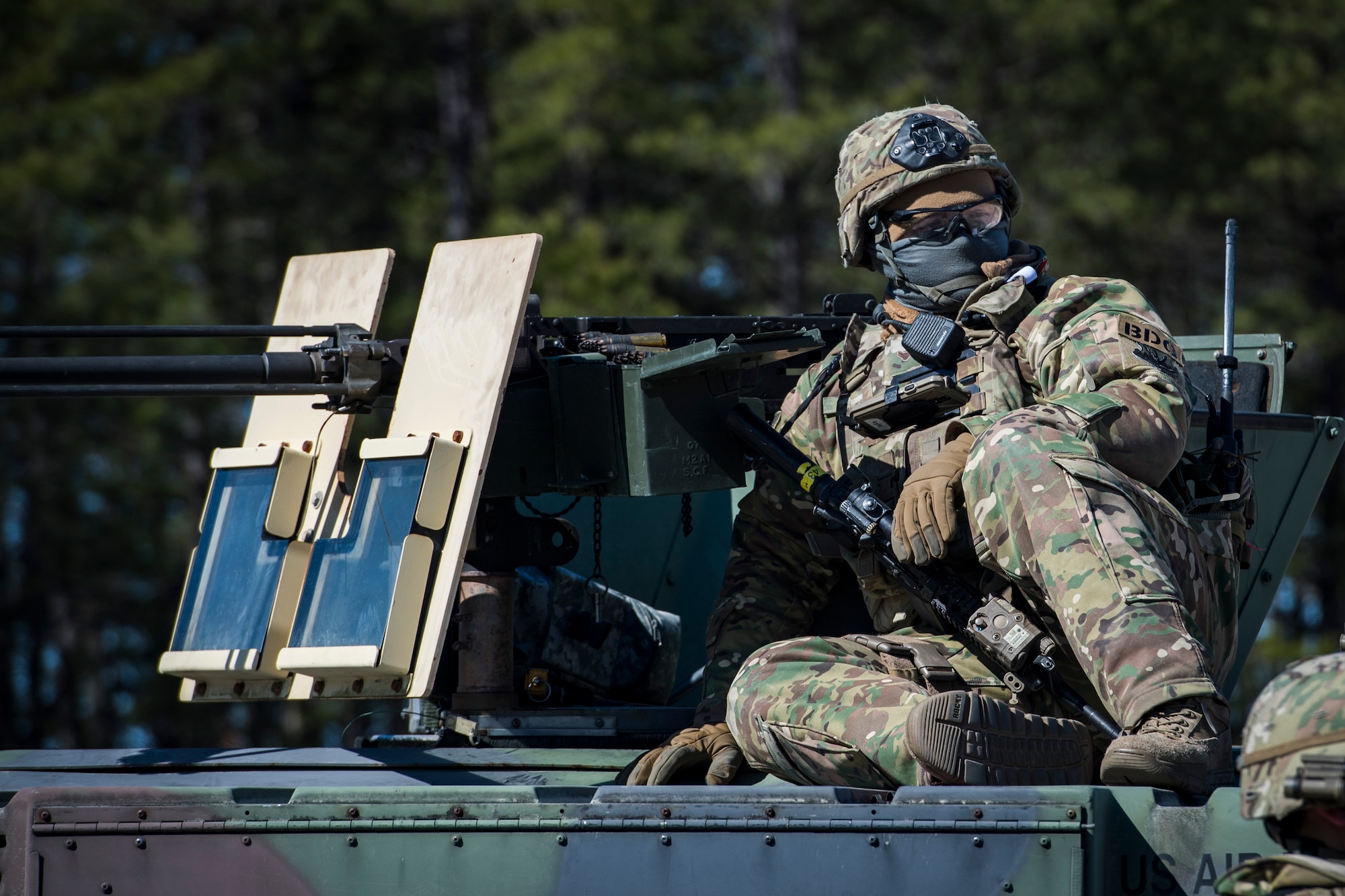 Airman 1st Class Devin Brown, 824th Base Defense Squadron fireteam member, sits on a Humvee during a Mission Readiness Exercise, March 13, 2018, at Joint Base McGuire-Dix Lakehurst, N.J. Evaluators tested the 824th BDS from Moody Air Force Base, Ga., and the 105th Security Forces Squadron from Stewart Air National Guard Base, N.Y., to ensure their combat readiness. (U.S. Air Force photo by Senior Airman Janiqua P. Robinson)