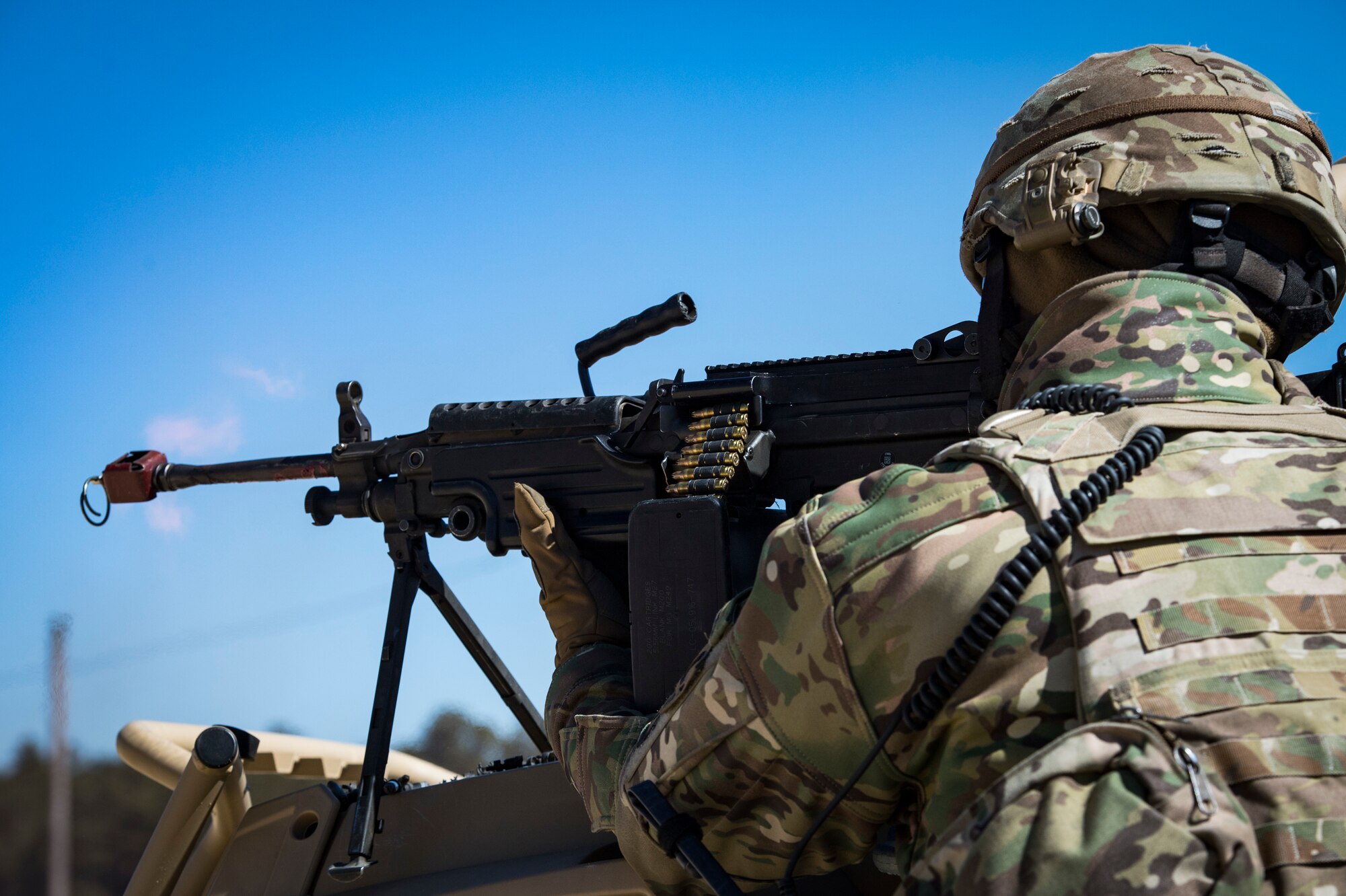 An Airman from the 824th Base Defense Group fires an M240B machine gun during a Mission Readiness Exercise, March 13, 2018, at Joint Base McGuire-Dix Lakehurst, N.J. Evaluators tested the 824th BDS from Moody Air Force Base, Ga., and the 105th Security Forces Squadron from Stewart Air National Guard Base, N.Y., to ensure their combat readiness. (U.S. Air Force photo by Senior Airman Janiqua P. Robinson)