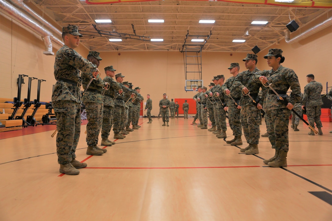 Marines from Corporal’s Course 630-18, held by U.S. Marine Corps Forces Command Headquarters, practice sword manual at Hopkins Hall Gym aboard Camp Allen, Norfolk, Va., March 21. Students were taught proper techniques for the guidon as well as the NCO sword during this class. (Official U.S. Marine Corps photo by Sgt. Mark Tuggle/Released)
