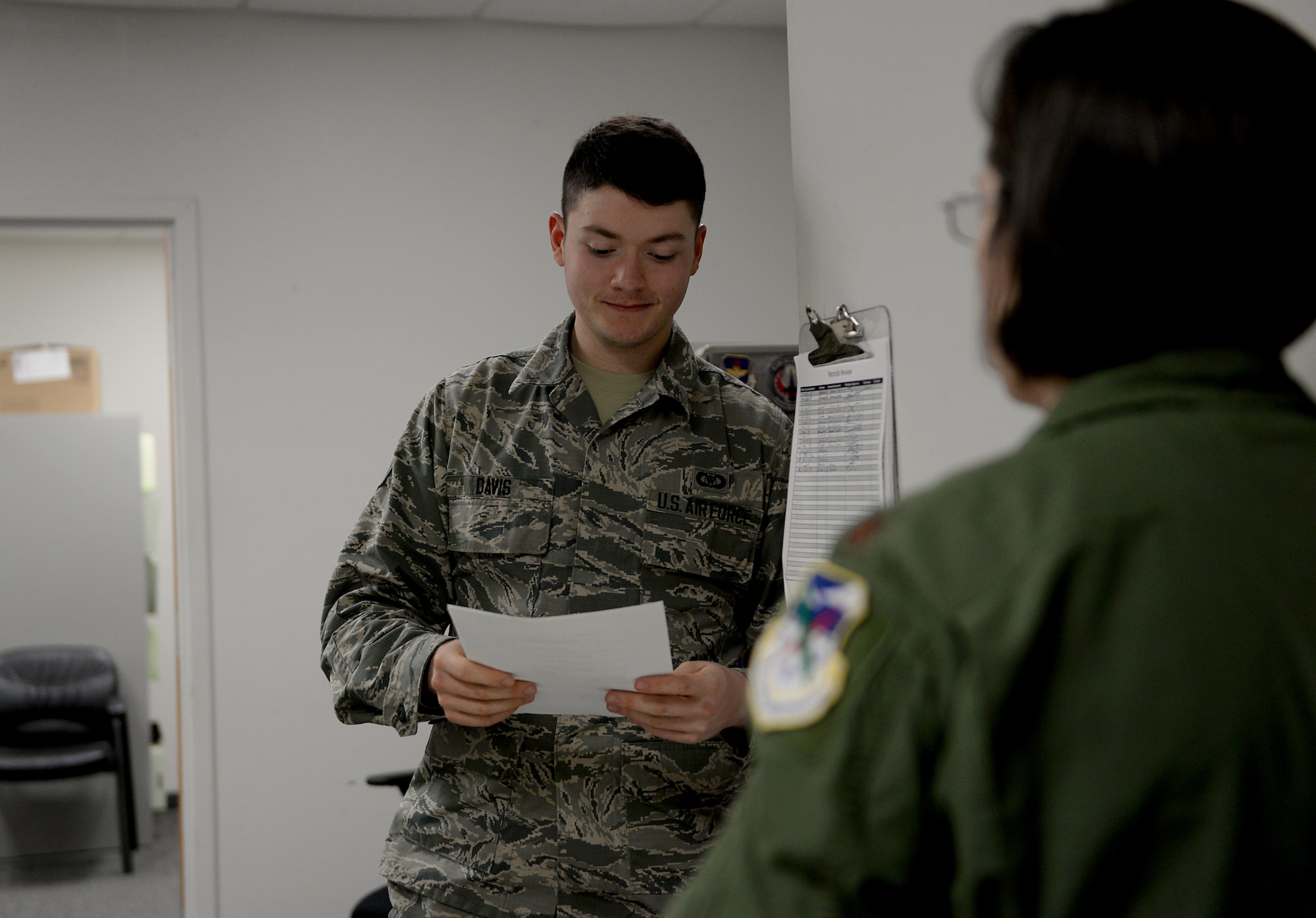 Airman 1st Class Jacob Davis, 14th Student Squadron aviation resource manager, helps a pilot with flying profile records March 20, 2018, on Columbus Air Force Base, Mississippi. Aviation Resource Management specialists maintain flight records to validate aircrew safety requirements, making sure every mission is ready to go according to plan. (U.S. Air Force photo by Airman 1st Class Keith Holcomb)