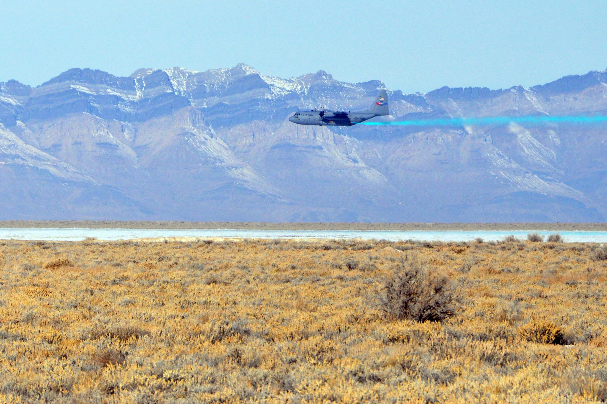 A 910th Airlift Wing C-130H Hercules aircraft performs an aerial spray pass over the Utah Test and Training Range, March 8.