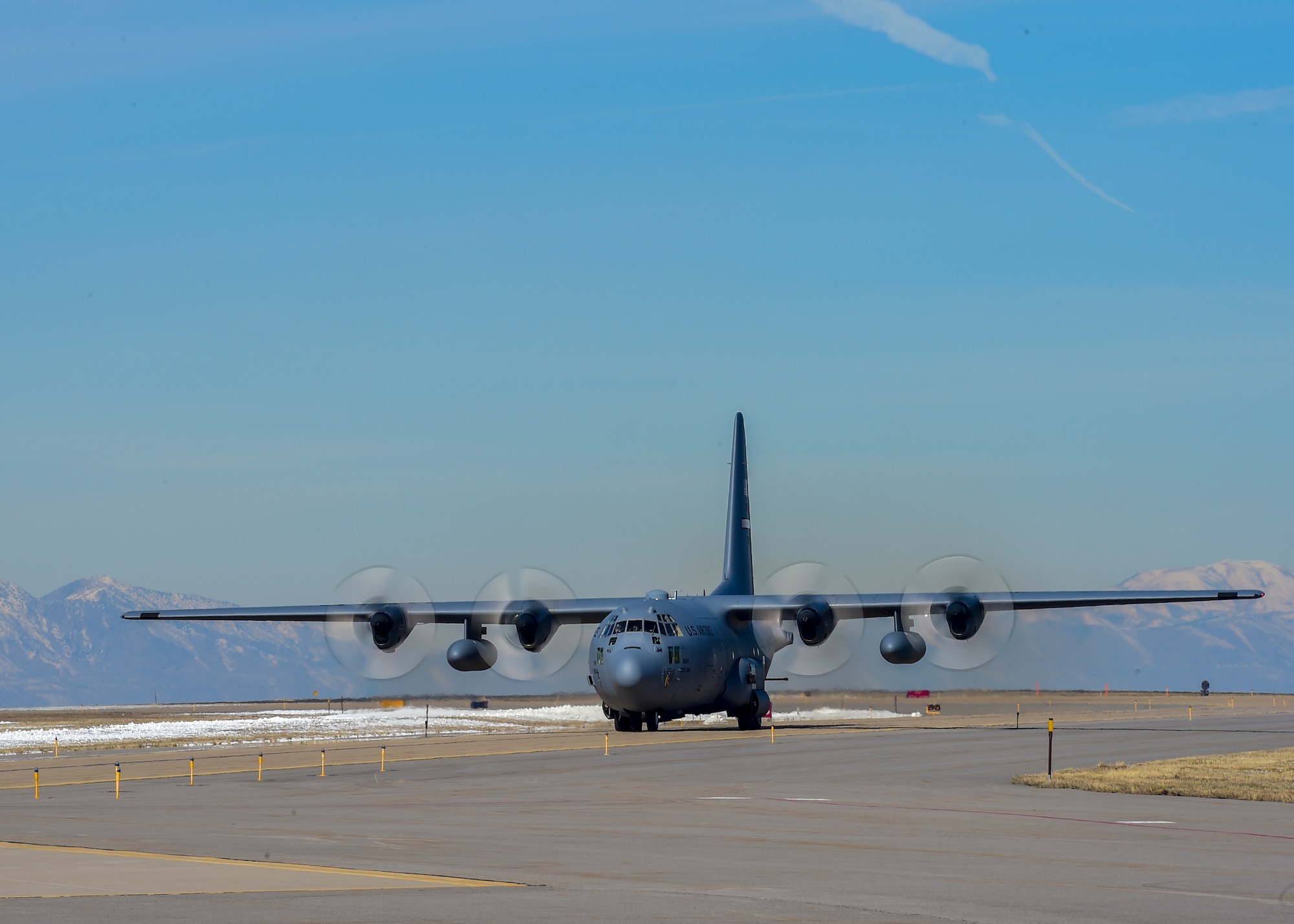 A panorama depicts a 910th Airlift Wing C-130H Hercules aircraft performing an aerial spray pass over the Utah Test and Training Range, March 8.