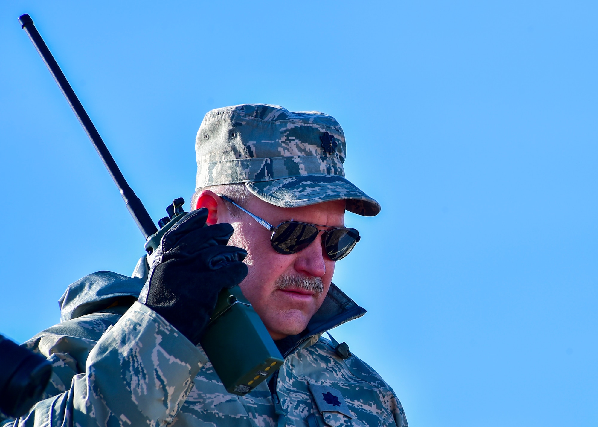 Lt. Col. Donald Teig, a medical entomologist assigned to the 757th Airlift Squadron, makes a radio call during an aerial spray mission over the Utah Test and Training Range, March 8.