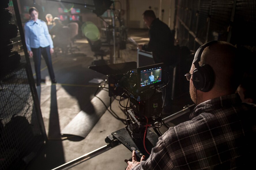 Michael McCool operates a camera as Burke Baker directs actor Aimee Lynn Chadwick while she narrates a portion of the Air Force Space Command’s production, “Space Superiority." (U.S. Air Force photo by Staff Sgt. Andrew Lee)