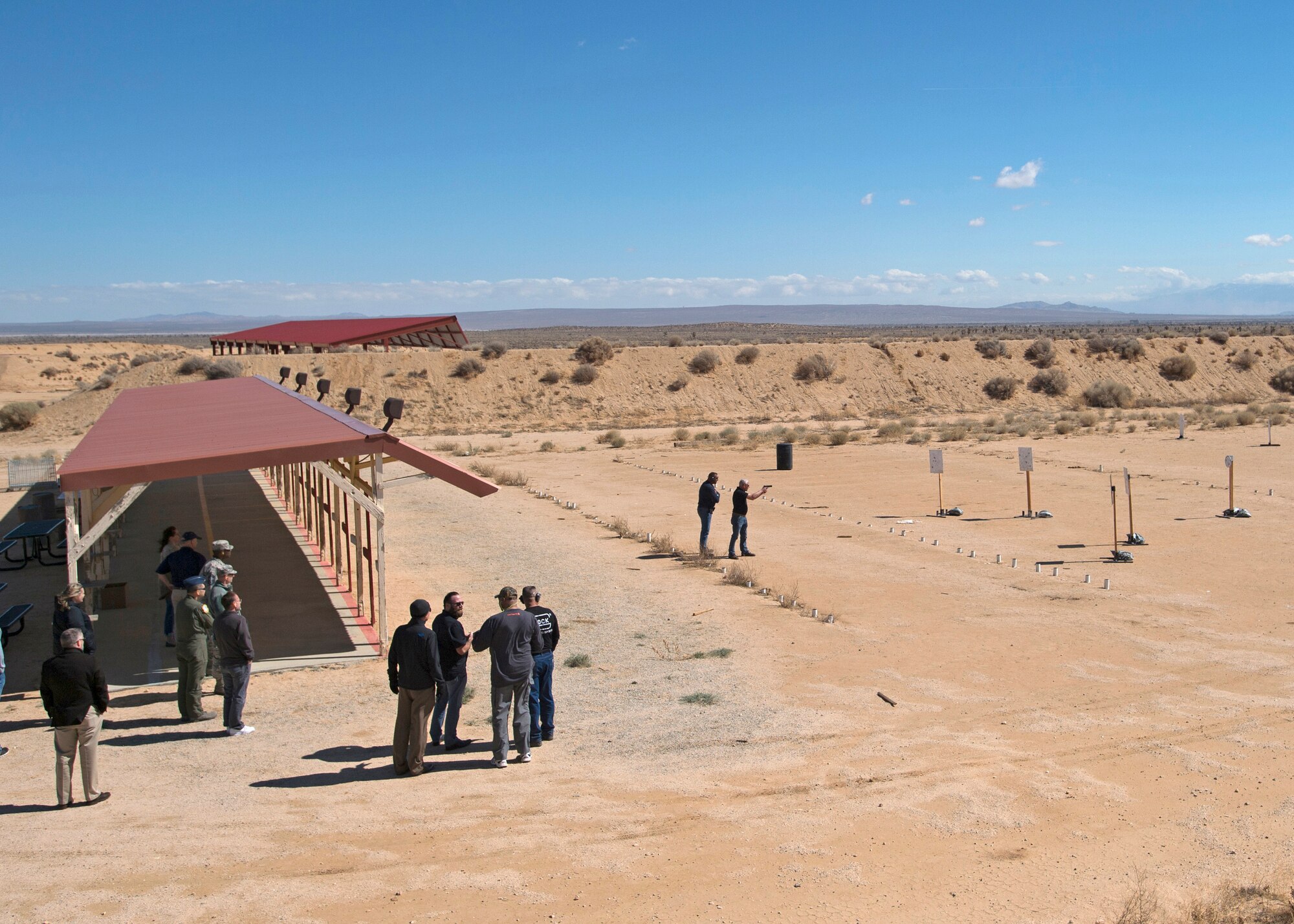 The honorary commanders traveled to the shooting range near the Rod and Gun Club where they received a firearms briefing and speed shooting demonstration by Francis “Len” Paris. Some of the HCCs took to the range for firearms practice. (U.S. Air Force photo by Joseph Pol Sebastian Gocong)