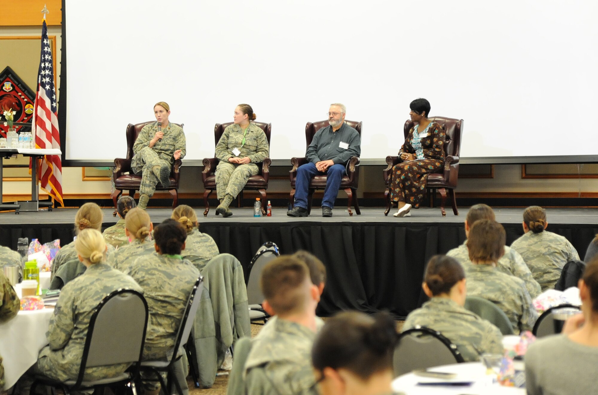 Maj. Samantha Miller, left, 341st Force Support Squadron commander, talks about working in a diverse environment during a women’s symposium panel discussion March 20, 2018, at Malmstrom Air Force Base, Mont. The two-day event included numerous guest speakers who discussed topics ranging from diversity and mentorship to money management and balancing military life with personal life. (U.S. Air Force photo by Christy Mason)