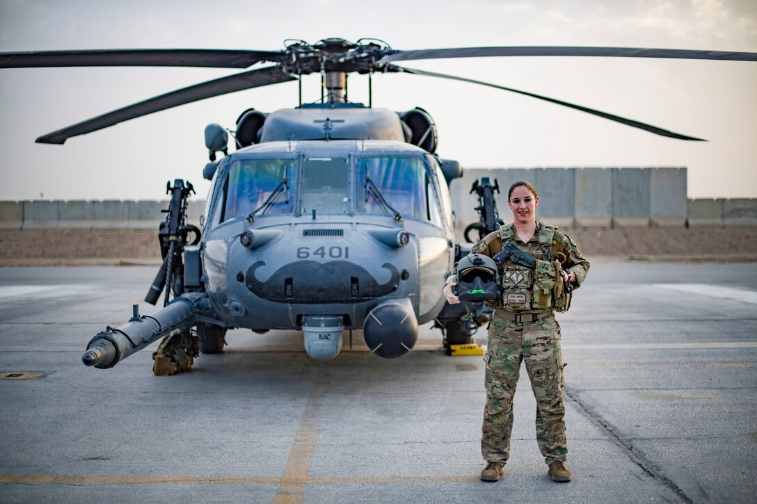 U.S. Air Force Capt. Victoria Snow, HH-60G Pave Hawk pilot, assigned to the 33rd Expeditionary Rescue Squadron, enters the aircraft in front of her aircraft before a training mission with a Guardian Angel team assigned to the 308th ERQS, Kandahar Airfield, Afghanistan in support of Operations Freedom's Sentinel and Resolute Support, March 13, 2018. The Guardian Angel Teams, consisting of combat rescue officers and pararescuemen work with the HH-60G aircrews to constantly maintain the highest levels of proficiency to ensure the successful execution of the personnel recovery/casualty evacuation mission set. (U.S. Air Force Photo by Tech. Sgt. Gregory Brook)