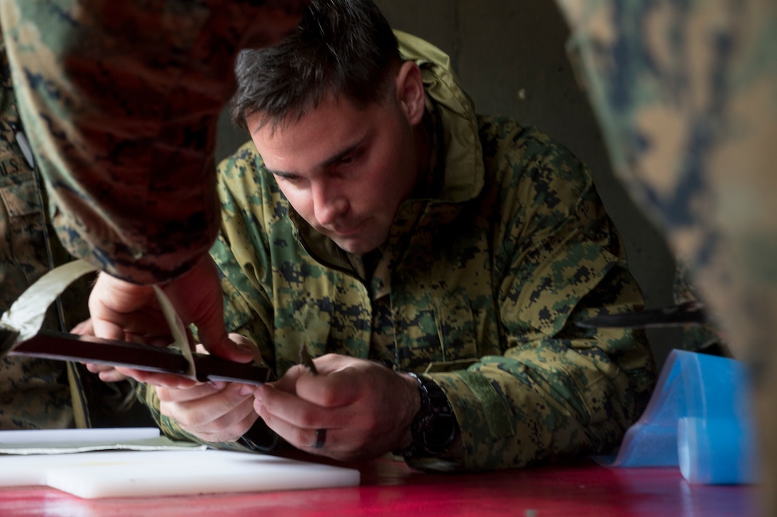 A Marine prepares an exterior strip charge during an urban breaching range at Camp Lejeune, N.C., Feb. 12, 2018. The range was conducted in preparation for the platoon’s upcoming deployment with the 22nd Marine Expeditionary Unit.  The Marine is with 2nd Reconnaissance Battalion, 2nd Marine Division. (U.S. Marine Corps photo by Cpl. Victoria Ross)