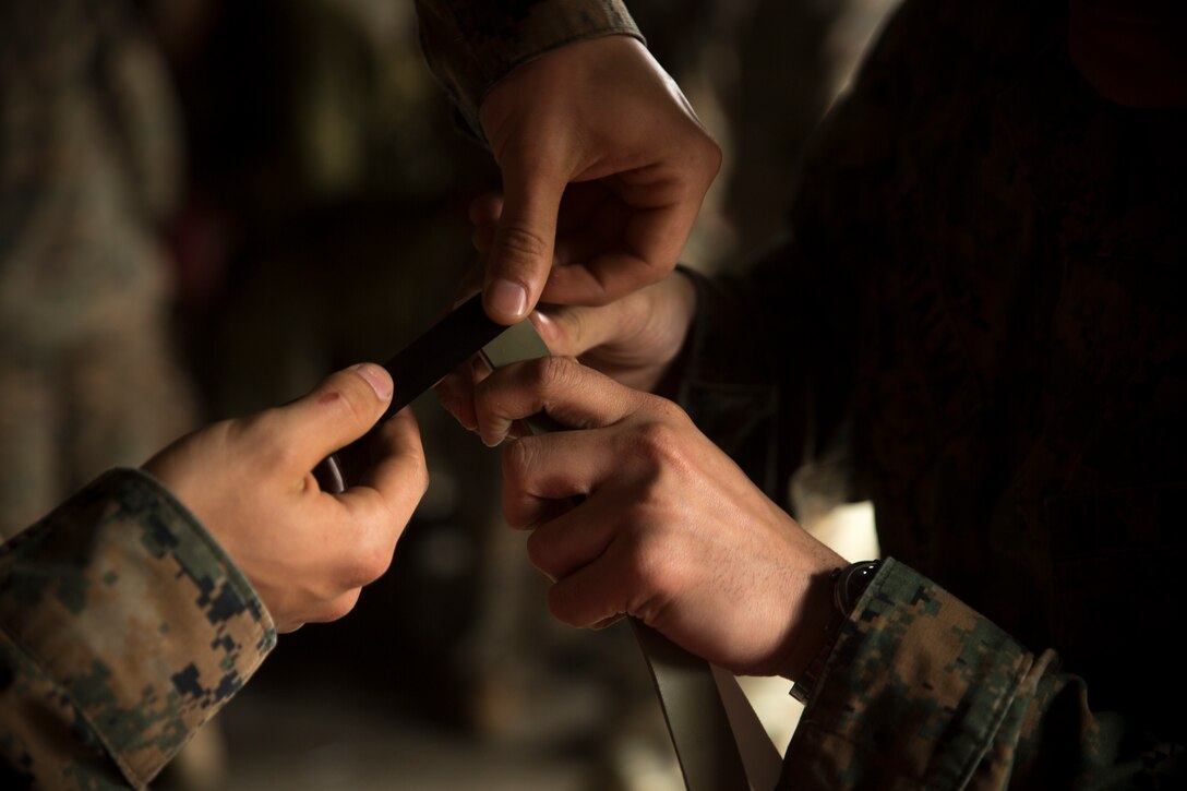 Marines with 2nd Reconnaissance Battalion, 2nd Marine Division build exterior strip charges during an urban breaching range at Camp Lejeune, N.C., Feb. 12, 2018. The range was conducted in preparation for the platoon’s upcoming deployment with the 22nd Marine Expeditionary Unit. The range allowed Marines to get hands-on training before moving on to qualifying exercises for the MEU. (U.S. Marine Corps photo by Cpl. Victoria Ross)