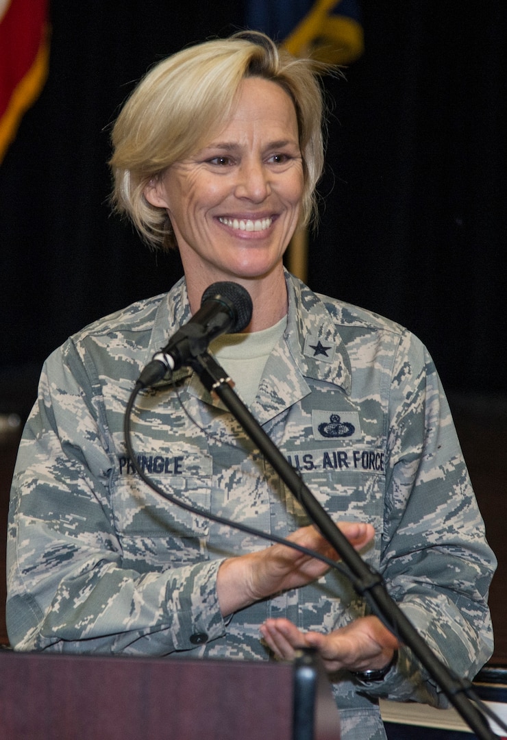 Brig. Gen. Heather Pringle, commander, 502nd Air Base Wing and Joint Base San Antonio, applauds the students entering the new Microsoft Software and Systems Academy during a ribbon-cutting ceremony at the Military & Family Readiness Center at Joint base San Antonio-Fort Sam Houston March 23. 
Leaders from the military, corporate and academic fields gathered to highlight the opening the new training center designed to prepare service members for jobs in the civilian information technology sector