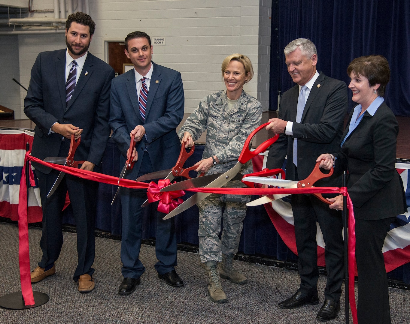 (From left) Jon Henry and Arnold Juvera from Microsoft; Brig. Gen. Heather Pringle, commander, 502nd Air Base Wing and Joint Base San Antonio; Dr. John Watret, Dr. John Watret, chancellor of Embry-Riddle Aeronautical University-Worldwide; and Lori Ham, Microsoft sales director, U.S. South Central Education, cut the ribbon to open the newest Microsoft Software & Systems Academy. The academy will be located at nearby JBSA-Randolph, and provide service members who are leaving the military with IT-related training and certifications.