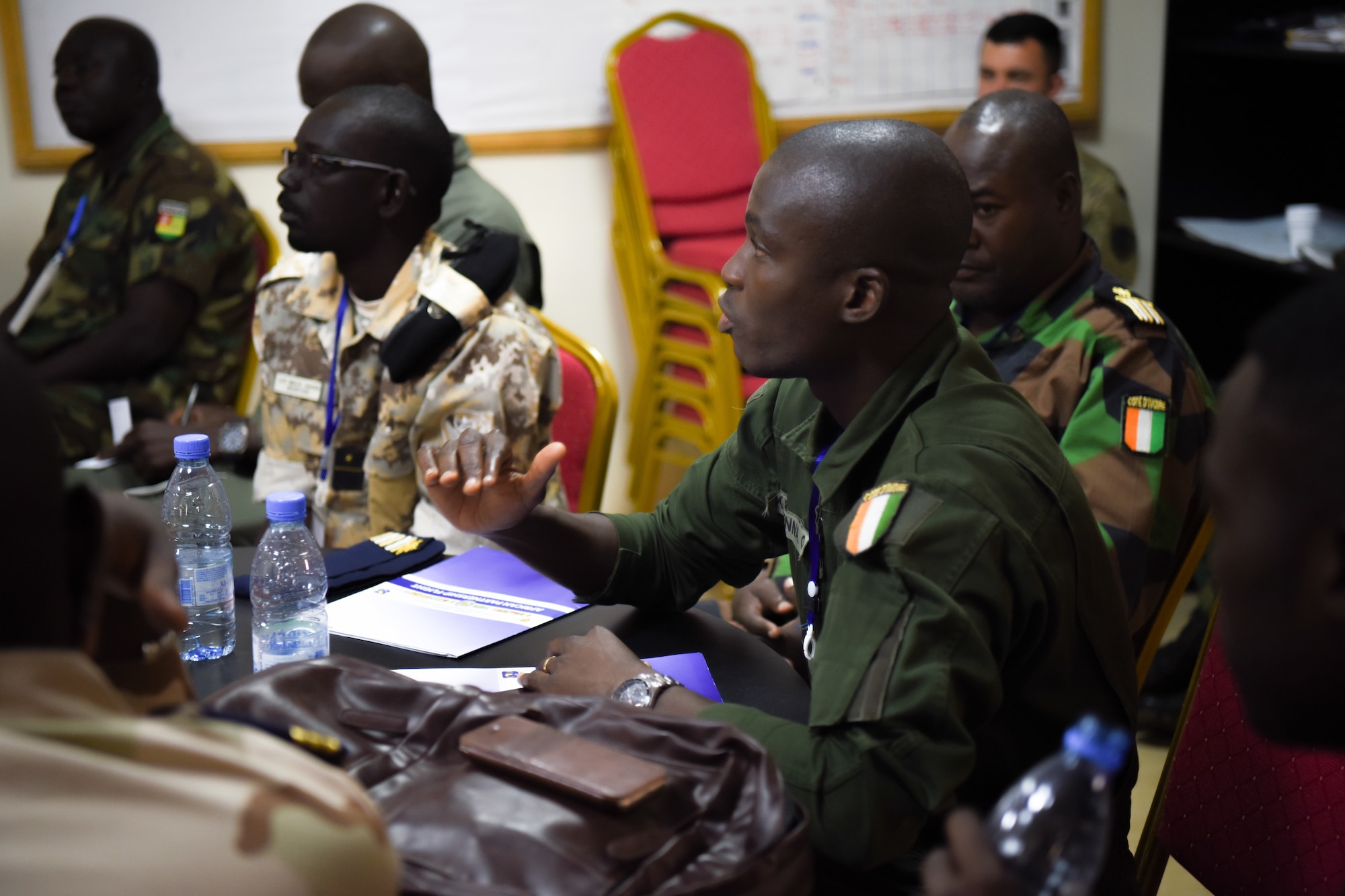Ivoirian Maj. Katienna Ouattara, asks a question at group discussions for air and ground safety during African Partnership Flight Senegal at Captain Andalla Cissé Air Base, Senegal, March 20, 2018. APF Senegal supports U.S. Africa Command’s priority to build capacity for humanitarian assistance and disaster response with African partners. (U.S. Air Force photo by Capt. Kay Magdalena Nissen)
