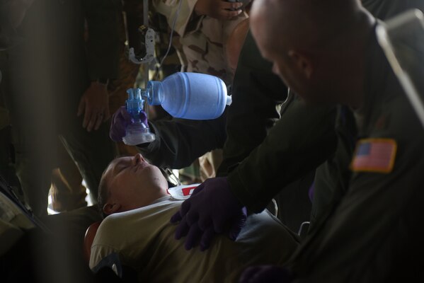 Airmen assigned to the 167th Aeromedical Evacuation Squadron, run through a simulated medical emergency in a C-130H Hercules, assigned to the 130th Airlift Wing, at Captain Andalla Cissé Air Base, Senegal, March 22, 2018. The Airmen are in Dakar in support of African Partnership Flight Senegal, a military-to-military event between the U.S. and nine African nations. (U.S. Air Force photo by Airman 1st Class Eli Chevalier)