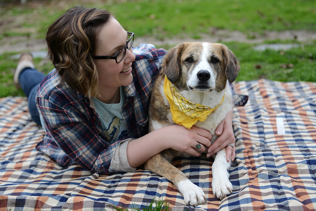 U.S. Air Force Tech. Sgt. Katie Ward, 633rd Air Base Wing Public Affairs media operations NCO in charge, gazes at her Bosnian rescue, Tanzie, in Hampton, Virginia, March 8, 2018.