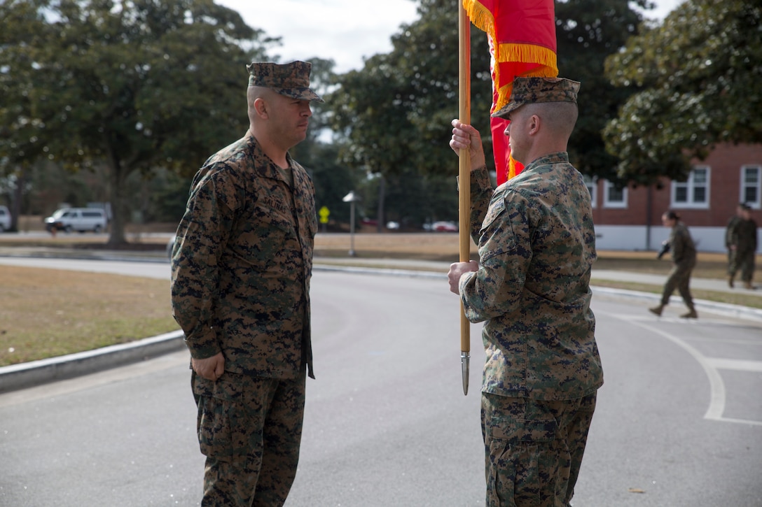 Lt. Col. Joshua Whamond receives the unit colors during an activation ceremony for the first ever II Marine Expeditionary Force Support Battalion at Camp Lejeune, N.C., Feb. 9, 2018. The new battalion, part of the II MEF Information Group, is designed to provide and coordinate combat-service support as well as security and administrative services to the MEF Command Element or Marine Expeditionary Brigade Command Element and MEF Information Group in order to sustain command and control of Marine Air-Ground Task Force operations. The activation of the MSB is in line with the Commandant's priorities to modernize the force and develop increased 21st century warfighting capabilities. Whamond is the MSB commander. (U.S. Marine Corps photo by Cpl. Victoria Ross)