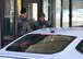 Airman 1st Class Brandon Hilliard, installation entry controller with the 319th Security Forces Squadron, left, and Senior Airman Dakota Smith, base defense operations center operator with the 319 SFS, interact with a driver passing through the main gate of Grand Forks Air Force Base, N.D., March 7, 2018. Installation entry controllers spend an average of 12 hours on each shift, staying vigilant and ensuring no one enters the base without authorization. (U.S. Air Force Photo by Airman 1st Class Elora J. Martinez)