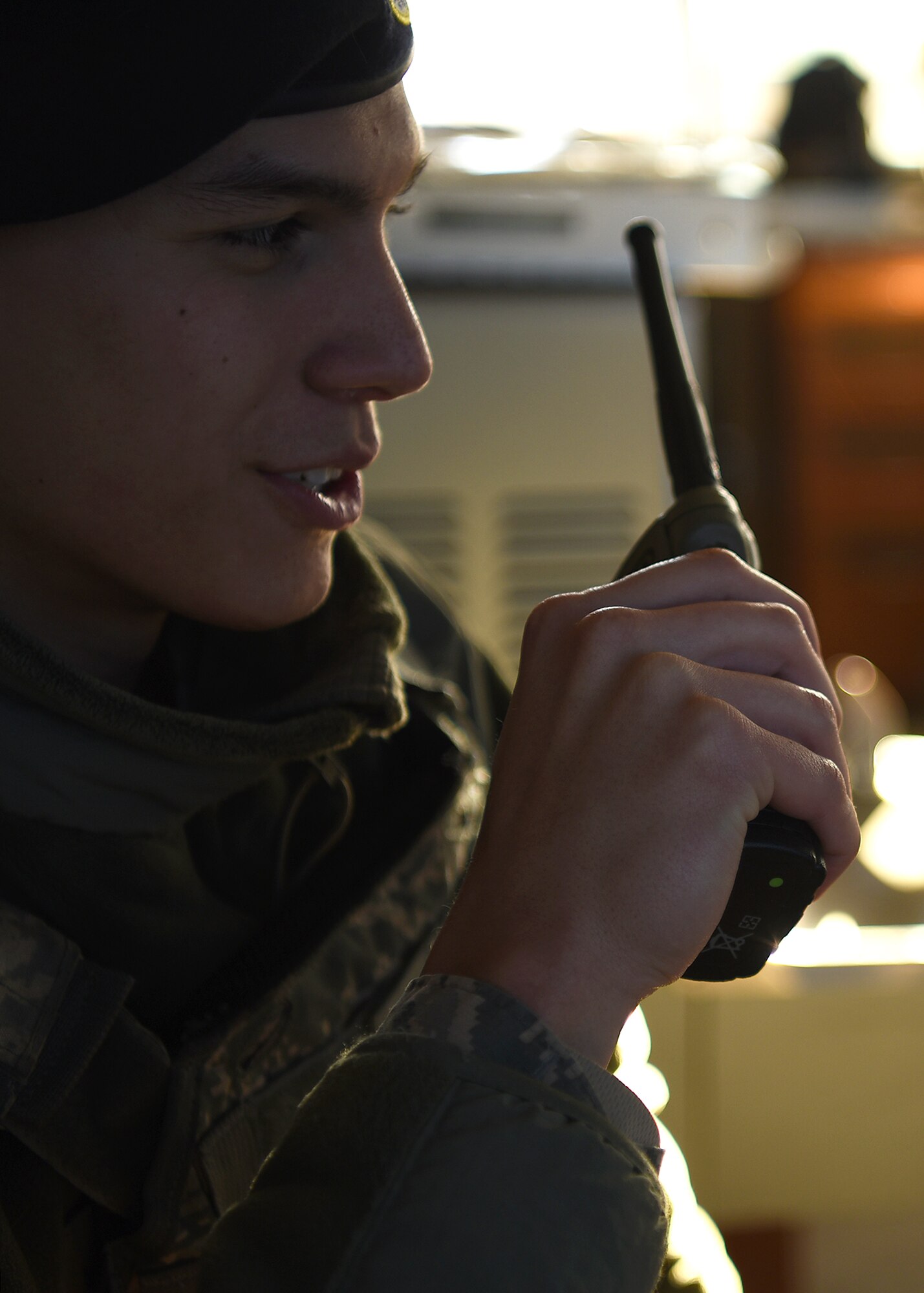 Airman 1st Class Brandon Hilliard, installation entry controller with the 319th Security Forces Squadron, conducts a radio check prior to finishing his shift March 7, 2018 at Grand Forks Air Force Base, N.D. Hilliard has been an installation entry controller and says his favorite part of the job is being able to interact with several people per day. (U.S. Air Force Photo by Airman 1st Class Elora J. Martinez)