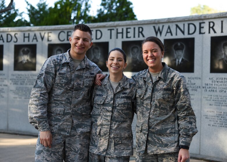 U.S. Air Force Airman 1st Class Emmett Berry, 96th Security Forces Squadron member, left, Airman 1st Class Elizabeth Berry, 33rd Fighter Wing supply support journeyman, center, Airman 1st Class Toula Goumas, 96th aerospace medical technician, right, pose for a photo March 21, 2018, at Eglin Air Force Base, Fla. These Airmen shared their journey into the Air Force and how all three were stationed at Eglin Air Force Base, Fla. (U.S. Air Force Airman 1st Class Daniella Pena)