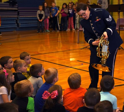 Staff Sgt. Helena Giammarco, USAF Band of Mid-America’s Mobility Brass Quintet member, explains the mechanics of her French Horn instrument during a performance at Mascoutah Elementary School, Illinois March 14, 2018. The performance were part of Air Mobility Command’s contribution to the Music in Our Schools month initiative. Giammarco hails from Besançon, France, and was previously a U.S. Navy Band member. (U.S. Air Force photo by Candy Knight)