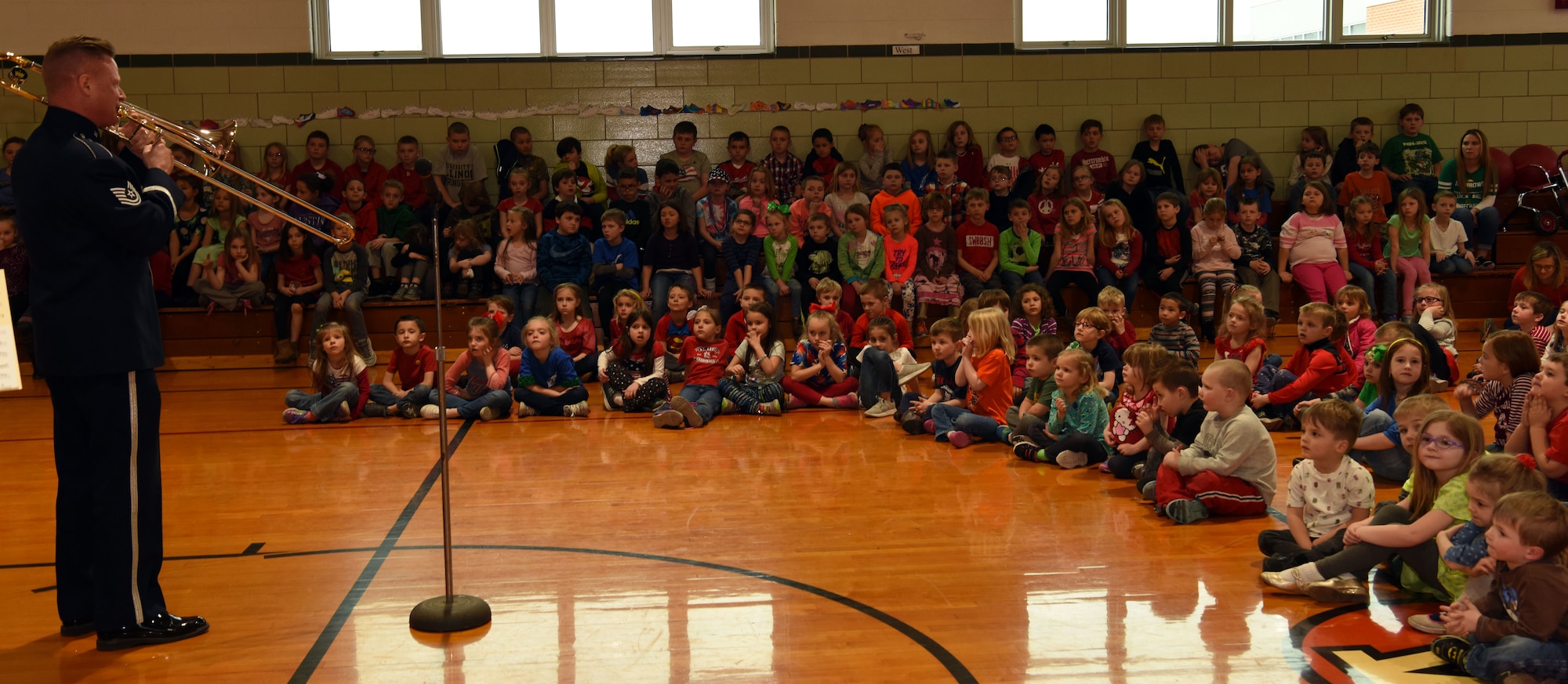 Tech. Sgt. Robert Hyatt, USAF Band of Mid-America’s Mobility Brass Quintet member, and Racine, Wisconsin native, performs for the “Hornheads Waltz” for Alhambra Primary School students March 16, 2018 at Alhambra Primary School, Alhambra, Illinois. The performance was part of Air Mobility Command’s Science, Technology, Engineering, Arts, and Mathematics-focused efforts to complement education efforts near and around AMC installations. During the 45-minute set, the group performed a variety of classical and popular music. The Hornheads were a brass ensemble assembled by Prince to accompany him on tour.(U.S. Air Force photo by Candy Knight)