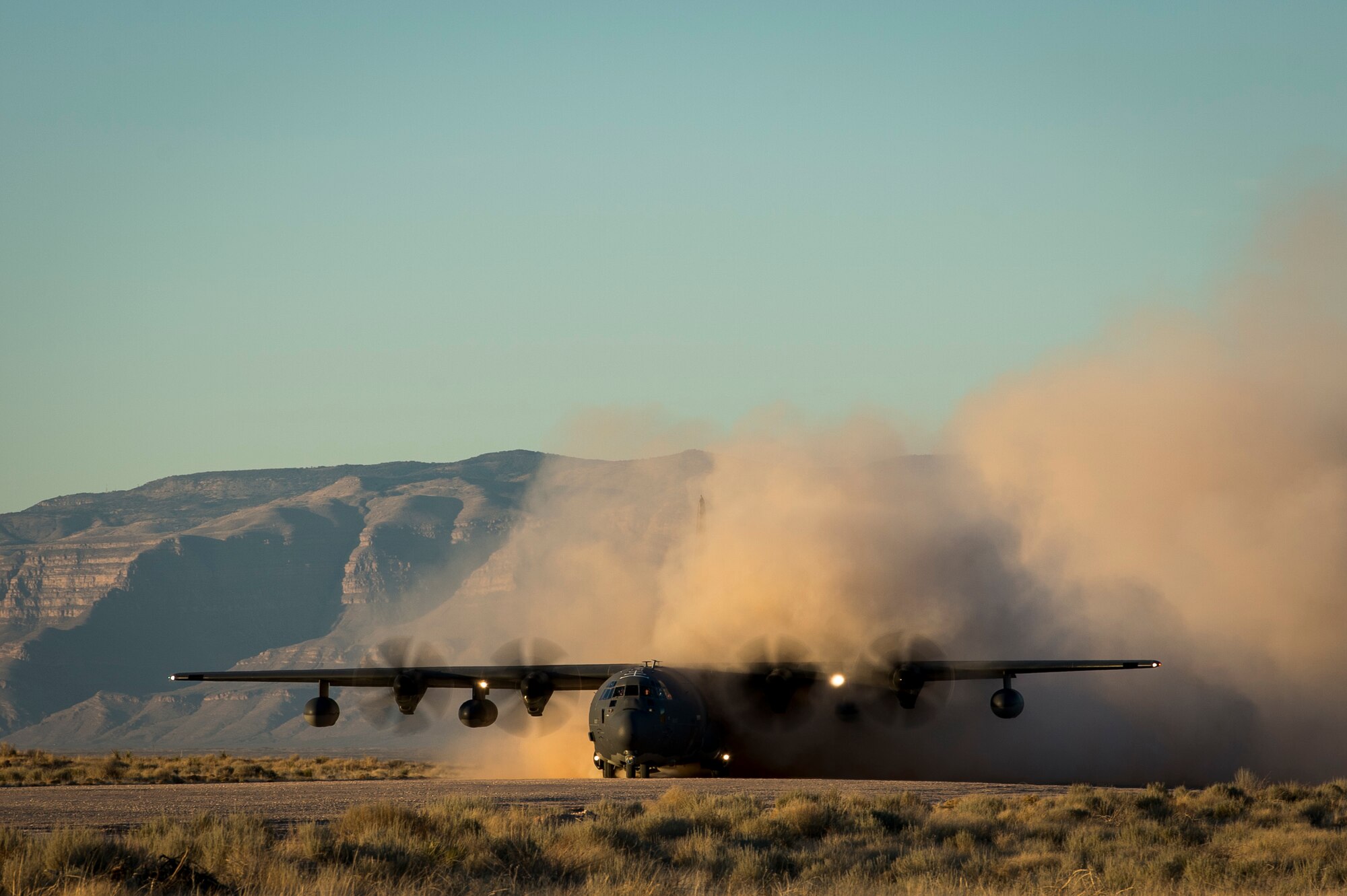 An MC-130J Commando II, assigned to the 9th Special Operations Squadron, lands at Orogrande, N.M., in preparation for the Marine Corps' high-mobility artillery rocket system launch during Exercise Emerald Warrior 18, March 5, 2018. The 14th Marine Regiment, is one of two Marine Corps HIMARS field artillery battalions, that provide fire support in austere locations.  (U.S. Air Force photo by Tech. Sgt. Larry E. Reid Jr.)